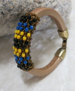 Leather bangle with netted beads standing upright
